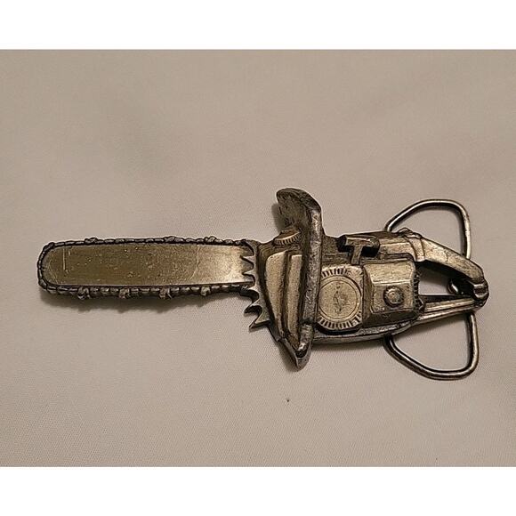 Chainsaw Belt Buckle 1978 Bergamot Brass Works Metal C-96 - Picture 1 of 6